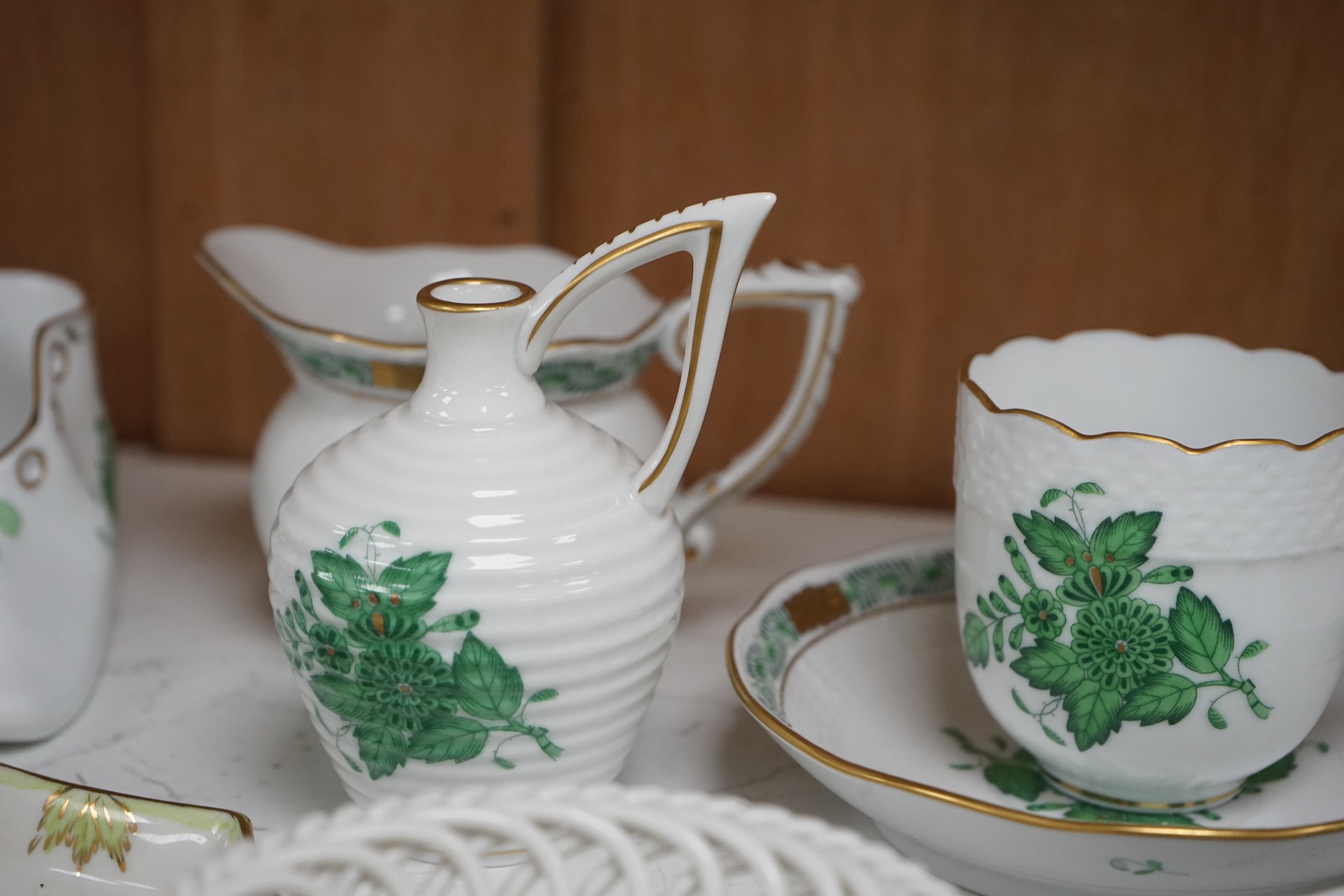 A collection of small items of Herend china: including eight items of a tea for two, a tureen and cover, a vase and various ticket dishes, baskets etc, coffee pot 13cm high. Condition - good